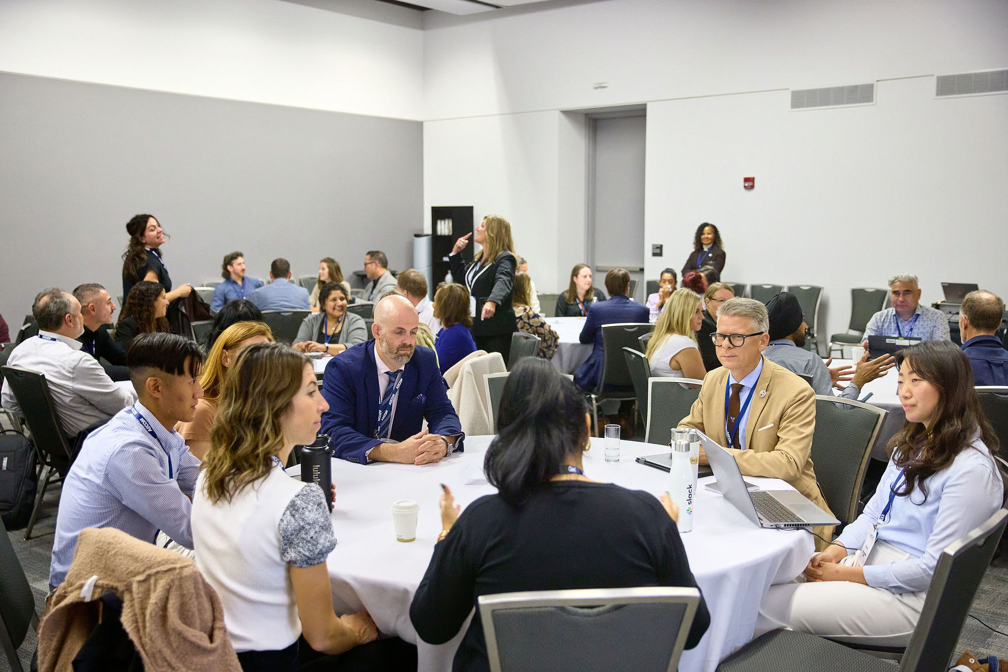 photo of a group of people talking at a table
